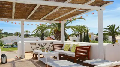 a patio with a couch and a table and chairs at Aldeia do Golf 151 - Clever Details in Vilamoura
