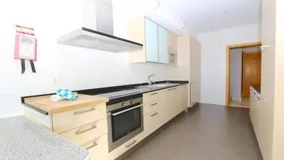 a white kitchen with a sink and a stove at Aquamar Sea View - Clever Details in Vilamoura