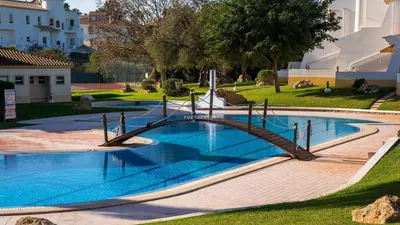 a swimming pool with a slide in a yard at São Rafael Beach Villa- D´alma Rafaella in Albufeira
