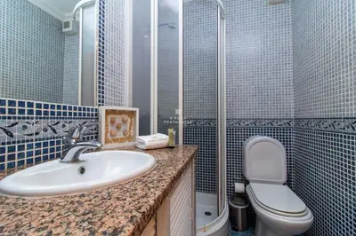 a bathroom with a sink and a toilet at São Rafael Beach Villa- D´alma Rafaella in Albufeira
