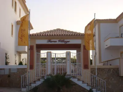 a entrance to a building with a sign that reads dream village at Sergio s Place - FARM VILLAGE - By Algarkasa in Albufeira