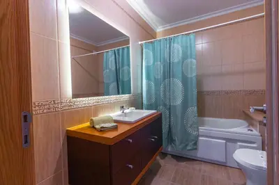 a bathroom with a sink and a toilet and a shower at Sergio s Place - FARM VILLAGE - By Algarkasa in Albufeira