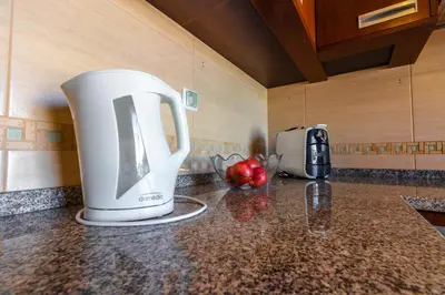 a coffee maker sitting on a counter in a kitchen at Sergio s Place - FARM VILLAGE - By Algarkasa in Albufeira