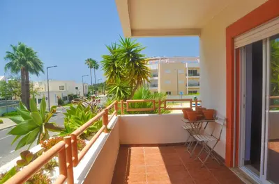 a kitchen with a sink and a washing machine at Beach House in Vilamoura: Terrace+pool in Vilamoura