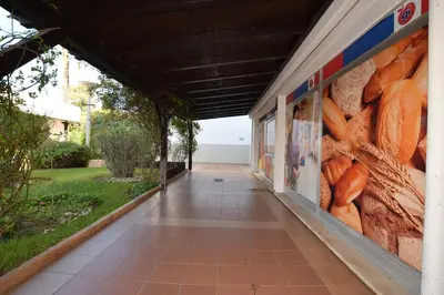 a hallway of a building with a mural of carrots at Casa Flor in Vilamoura