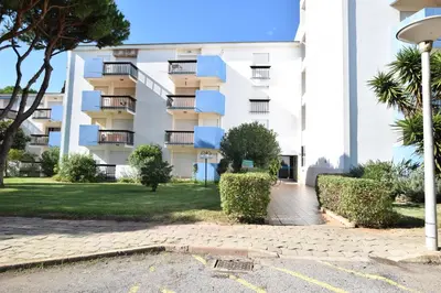 a building with balconies and bushes in front of it at Casa Flor in Vilamoura