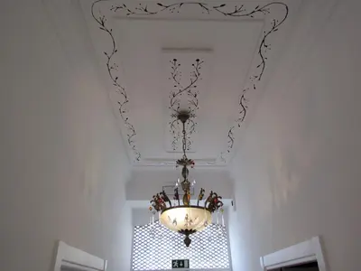 a chandelier hanging from a ceiling in a room at Terrace Barqueta Studio in Faro