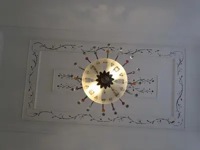 a chandelier hanging from a ceiling in a room at Terrace Barqueta Studio in Faro