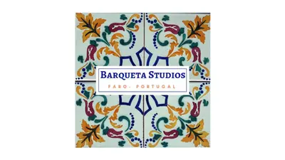 a label for barcelona studio with a patterned tile at Yellow Barqueta Studio in Faro