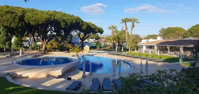 a bedroom with a large bed and a window at Apt P209 situé au sein de Balaia Golf Village in Albufeira