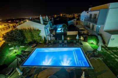 a villa with a swimming pool and a house at Boutique & Villas Boliqueime in Boliqueime