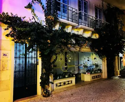 a store front of a building with a display window at Senhor Gigi in Faro