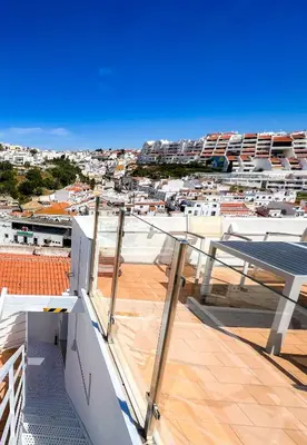 a balcony with a view of a city at Studio Sal in Albufeira