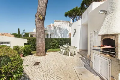 a swimming pool in the backyard of a house at Residential cul-de-sac walking distance to centre, private pool, free AC wifi in Loulé