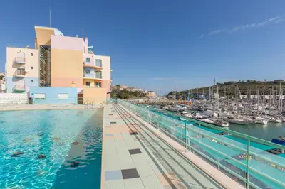 a view of a marina with boats in the water at SeaShell Apartment by Atlantic Places in Albufeira