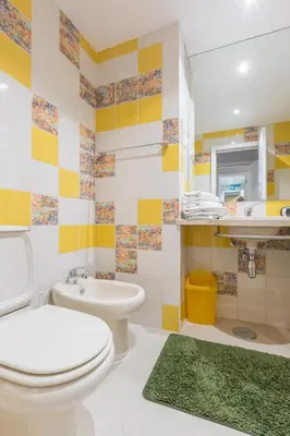a bathroom with a white toilet and a sink at SeaShell Apartment by Atlantic Places in Albufeira