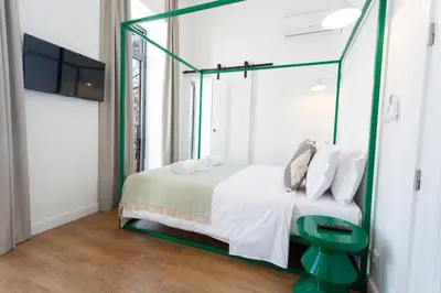 a bedroom with a bed with a glass canopy at Alameda Exclusive House in Faro