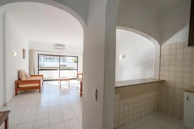 a bathroom with a tile floor and an archway at Eirasol by Umbral in Albufeira