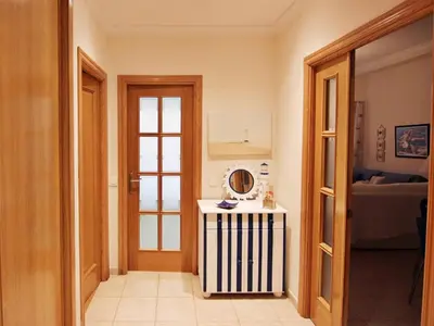 a hallway with a small table in a room at Los Arcos Apartment I in Vilamoura