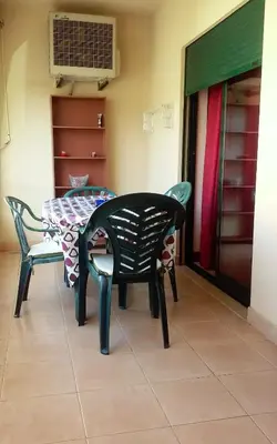 a dining room with a table and chairs at Salgados Village T1 in Albufeira