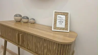 a shelf with three vases and a sign on it at The Market Square House in Faro