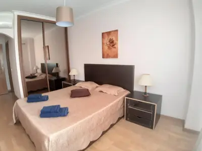 a bedroom with a bed with two pillows on it at Casa Sol da Falesia in Albufeira