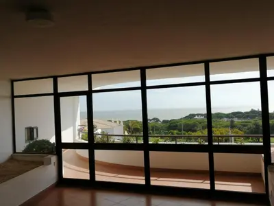 a room with a large window with a view at Albufeira INN - CORAL T1 in Albufeira