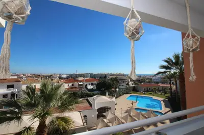 a view of the pool from the balcony of a resort at MAIN AVENUE ALBUFEIRA, walk to beach, Old Town, shooping, top location in Albufeira