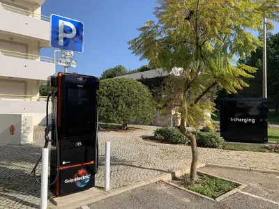 a parking meter next to a tree next to a building at Ribas - Cozy 2 bedroom apartment - Vilamoura in Vilamoura