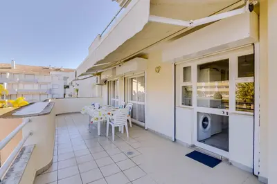 a balcony of a house with a table and chairs at Ribas - Cozy 2 bedroom apartment - Vilamoura in Vilamoura