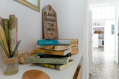 a stack of books sitting on a table at Old Charming House Faro in Faro