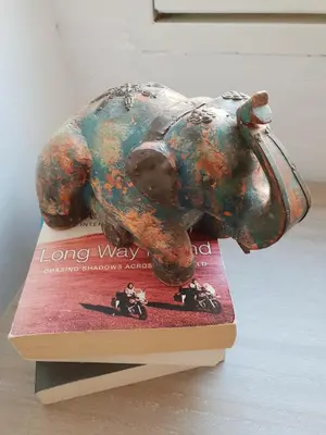 an elephant statue sitting on top of a book at Old Charming House Faro in Faro