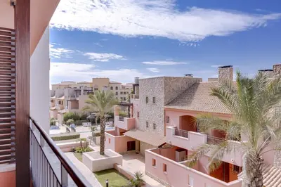 a view from the balcony of a building with palm trees at Amazing 2Bedroom apartment in Victoria Boulevard in Vilamoura