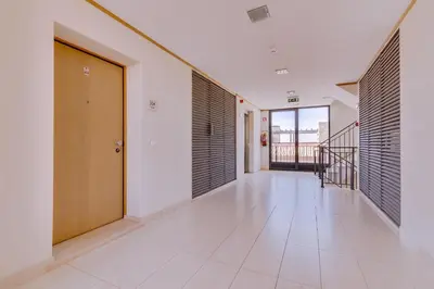 an empty hallway with a door and a staircase at Amazing 2Bedroom apartment in Victoria Boulevard in Vilamoura