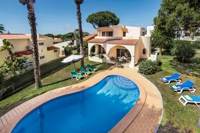 an aerial view of a house with a swimming pool at Exclusive Retreat in Vilamoura, private pool, off-street parking, Free AC wifi in Quarteira