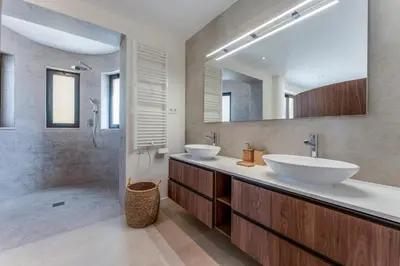 a bathroom with two sinks and a shower at Villa Natura in Vilamoura