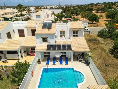 an aerial view of a house with a swimming pool at Villa Chiquito Albufeira - Private Pool&Parking - BBQ&AC&WI-FI in Albufeira