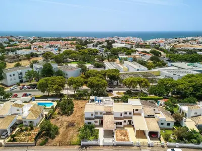 an aerial view of a city with houses at Villa Chiquito Albufeira - Private Pool&Parking - BBQ&AC&WI-FI in Albufeira
