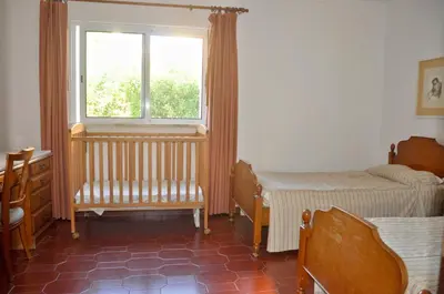 a living room with two chairs and a table at Stylish well-equipped, private pool, close to amenities, free AC Wifi in Quarteira