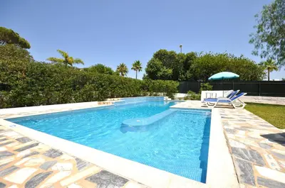 a bathroom with a shower and a sink and a tub at Delightful single-storey villa, private pool, free air conditioning and wifi in Vilamoura