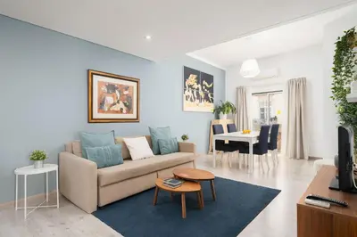 a living room with a couch and a table at Downtown Lux Apartment in Faro