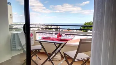 a table and chairs on a balcony with a view at Sea View5 in Albufeira