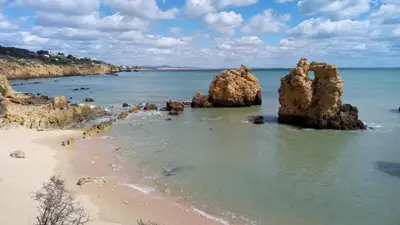 a view of a beach with rocks in the water at Sea View5 in Albufeira