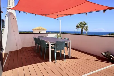 a bottle of champagne in a bath tub on a balcony at Villa Bellevue in Albufeira