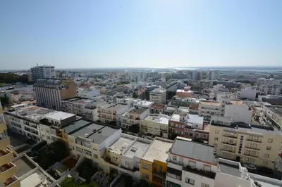 an aerial view of a city with buildings at Wonderful view in the city center in Faro