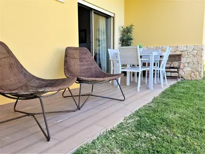 a patio with a table and chairs on it at Albufeira Prime Apartment in Albufeira