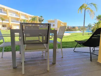 a table and chairs sitting on top of a patio at Albufeira Prime Apartment in Albufeira