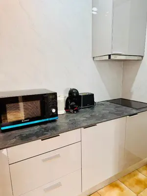 a kitchen with a microwave on a counter at Apartment Old Town Telheiros in Albufeira