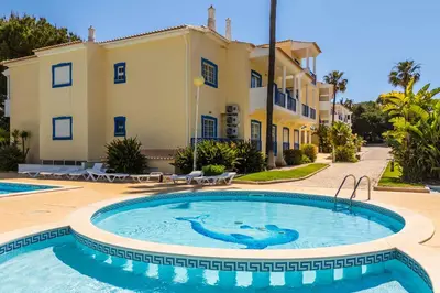 a swimming pool in front of a villa at Bosque São José by Algarneto in Albufeira