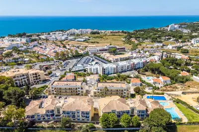 an aerial view of a resort with the ocean at Bosque São José by Algarneto in Albufeira